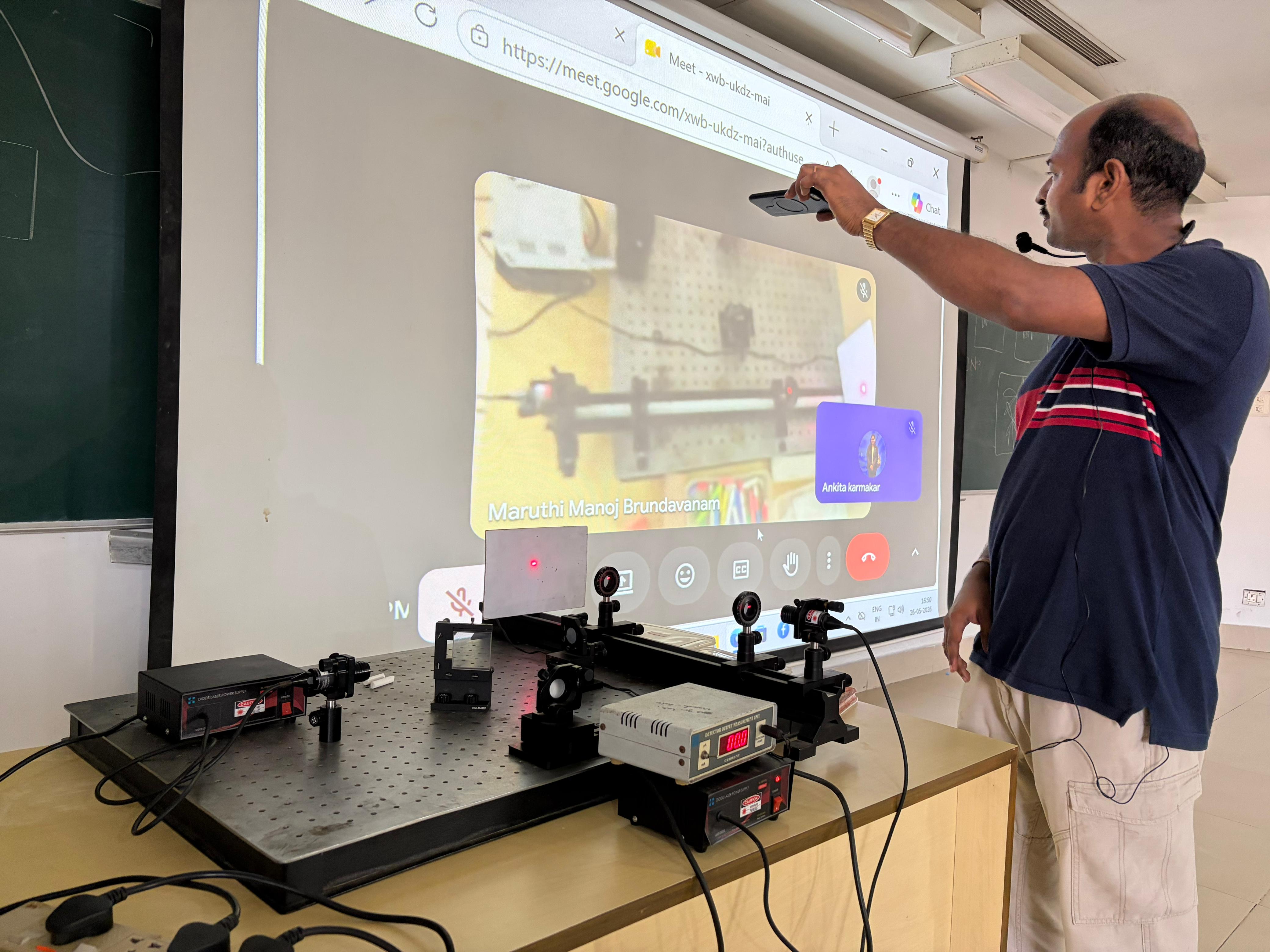 Faculty members demonstrating scientific concepts through engaging live experiments.