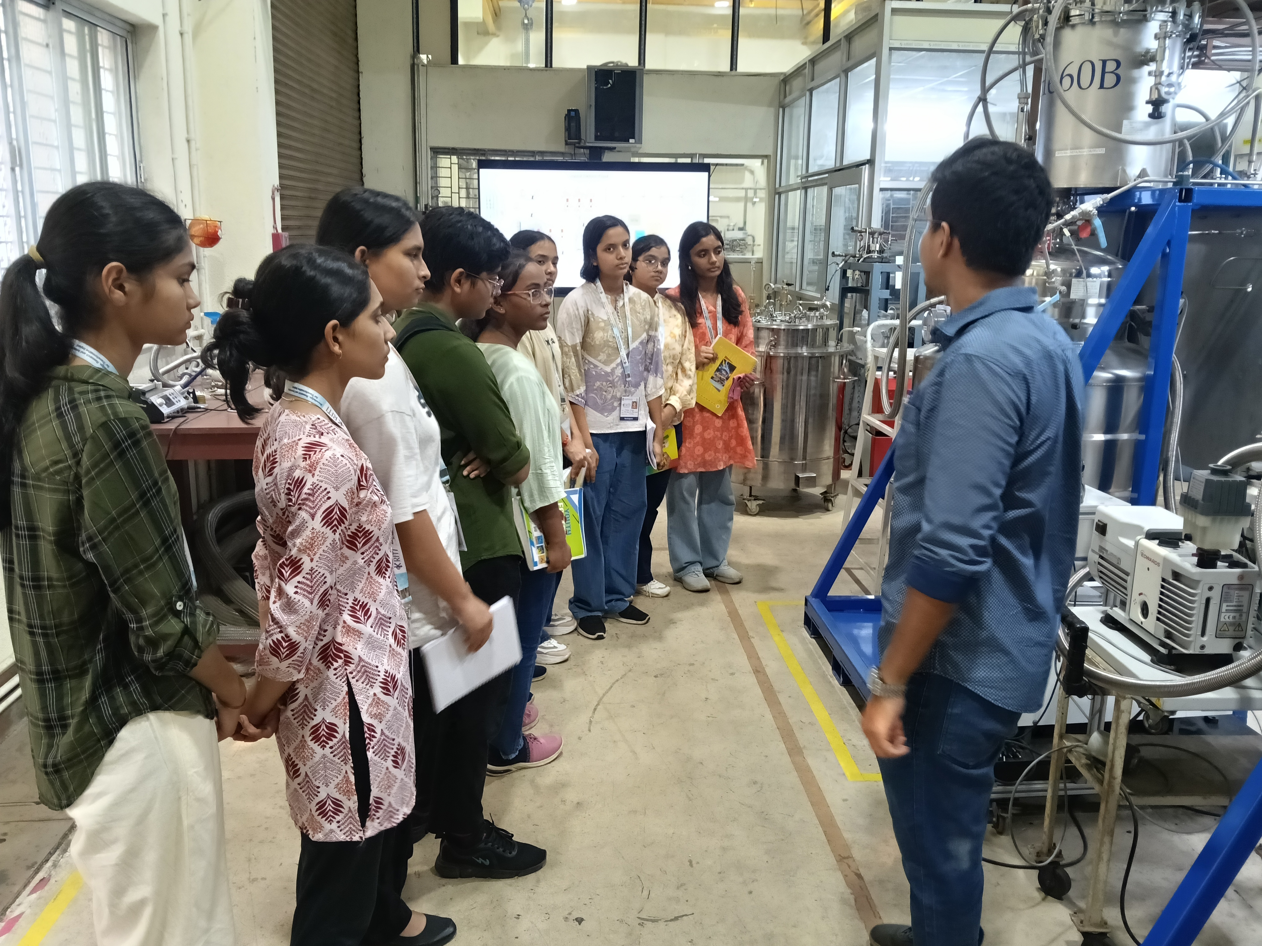 Students engaging with advanced research facilities and scientific instruments.